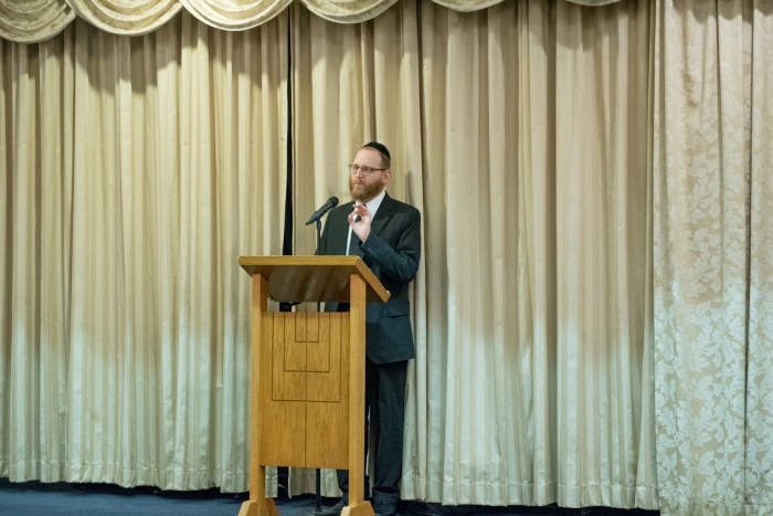 Rabbi Dovid Rosen Speaking At The Cor Pre Pesach Community Event Title Image